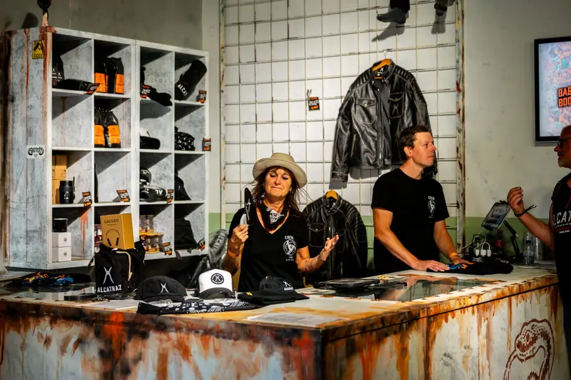 Merch counter with jackets and caps