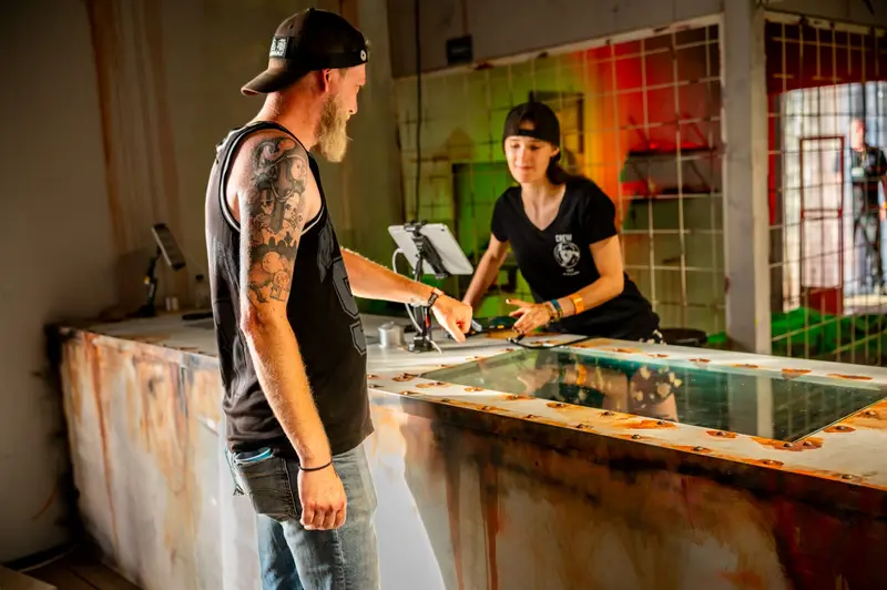 Merch crew working at the counter