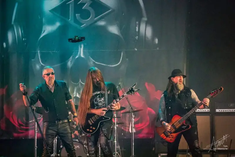Metal band guitarists live on stage