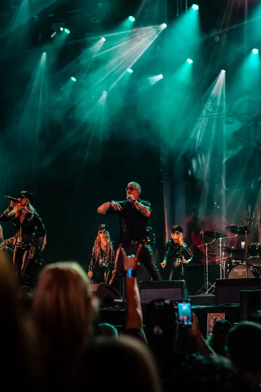 Metal band on stage in green light