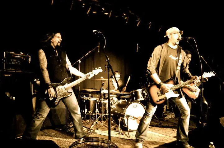 Rock band playing live on a club stage