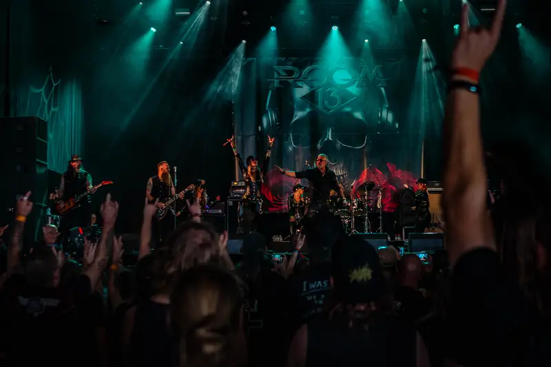 Rock concert crowd in front of a dark stage